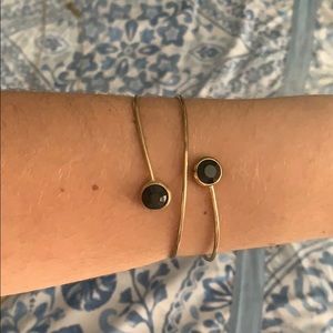 Gold bracelet with black stones